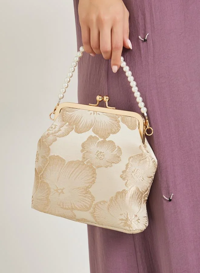 ستايلي شنطة يد بالزهور ومقبض لؤلؤ